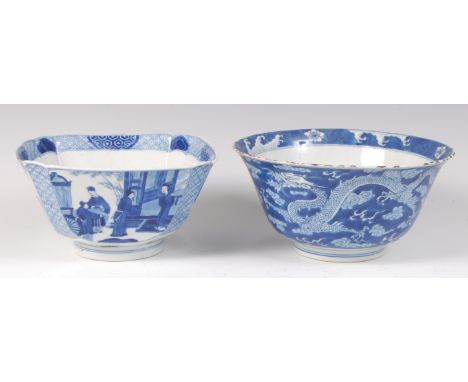 A Chinese Kangxi period porcelain footed bowl, of tapering square section, blue and white decorated with four reserves of cer