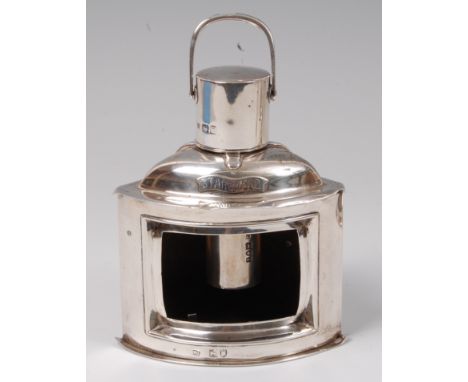 An Edwardian silver novelty table lighter in the form of a ships starboard lantern, lacking glass, maker Samuel Jacob, London