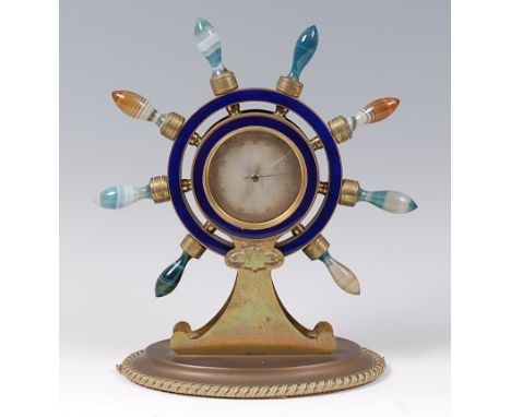 A Victorian brass and agate ships wheel barometer, the handles formed from turned and banded agate, turning to adjust the cen