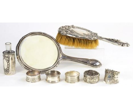 FIVE SILVER NAPKIN RINGS, VARIOUS MAKERS AND DATES, A SILVER SCENT BOTTLE-SLEEVE, AN ART NOUVEAU SILVER HAIRBRUSH AND A SILVE