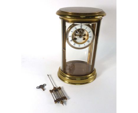 A 19th century oversized carriage-type clock, the movement striking on a bell with a mercury pendulum, the enamelled face wit