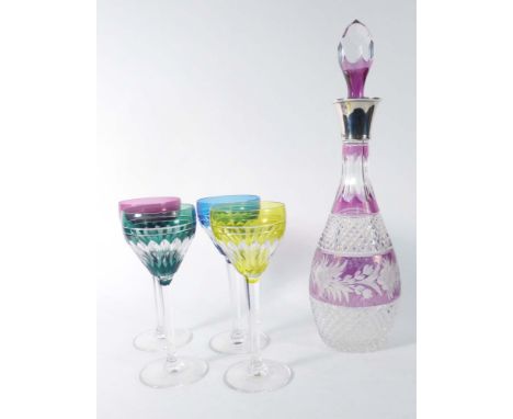 A silver mounted amethyst flashed glass decanter and stopper, Birmingham 1975, h. 38 cm, together with a set of four similar 