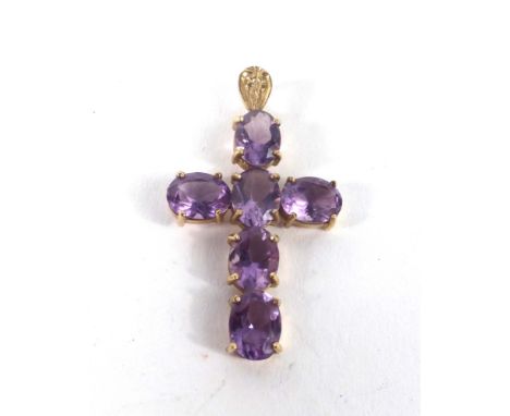 A 9ct yellow gold pendant in the form of a cross set oval cut amethyst, l. 3.9 cm,3.5 gms