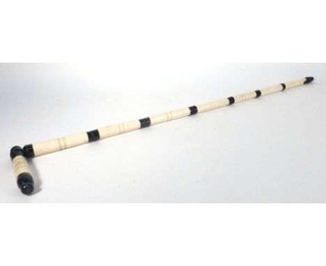 A 19th century walking stick constructed of ivory and ebony sections