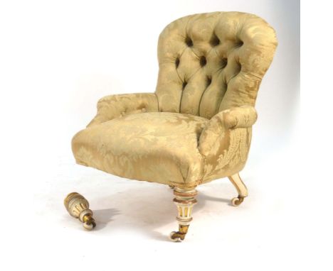 A button upholstered low chair on white and gilt feet CONDITION REPORT: One foot detached