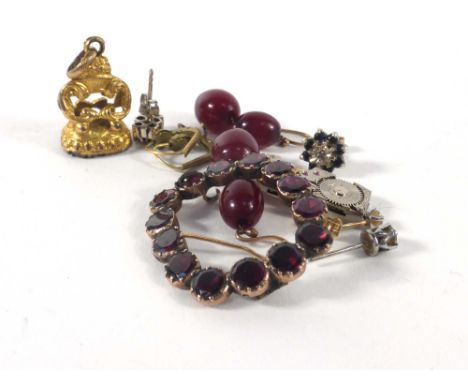 A small parcel of jewellery including a pair of cornelian earrings, a gilt metal seal fob, a Rotary watch movement and other 