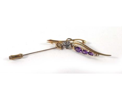 A yellow metal bar brooch in the form of a three leaf clover and set rose cut diamonds, w. 4.2 cm, together with a 9ct yellow