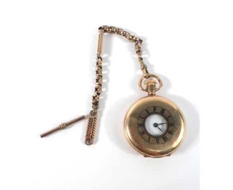 A gold plated half hunter pocket watch, the white enamel dial with black Roman numerals and second hand section within a plai