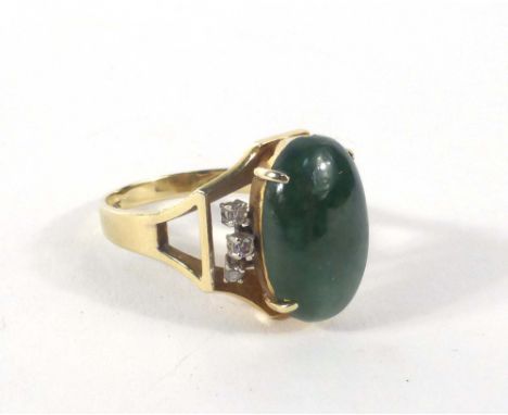 A 14ct yellow gold ring set oval cabochon cut jade and six small diamonds in a raised openwork setting,ring size S 1/2,7.9 gm