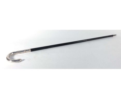 A Continental ebonised walking stick with a silver handle, stamped 800