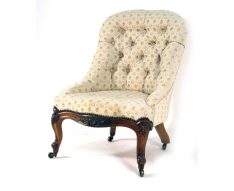 A Victorian and later button upholstered nursing chair on walnut turned feet