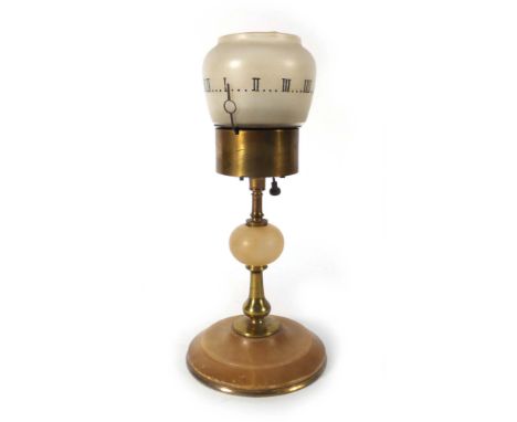 A French miniature oil lamp clock, the movement stamped Brevete S.G.D.G., h. 20 cm CONDITION REPORT: Crack to base, working o