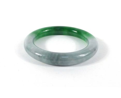 A green/white jade bangle, internal d. 5.6 cm