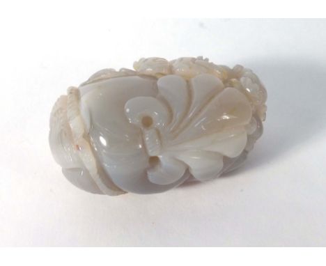 A Chinese jade carving modelled as a beast clambering over a basket, l. 8.5 cm CONDITION REPORT: Varies in colour. Some typic
