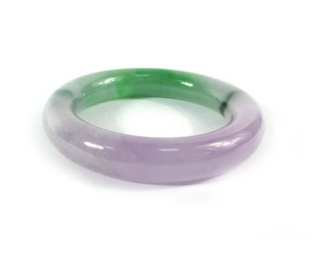 A purple/green jade bangle, internal d. 5.8 cm
