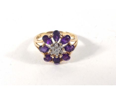 A 9ct yellow gold cluster ring set diamonds and amethyst in a flowerhead setting,ring size P,2.8 gms