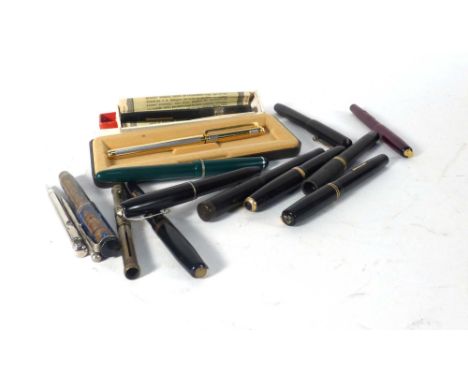 A group of fifteen vintage ink pens including some with 14k nibs