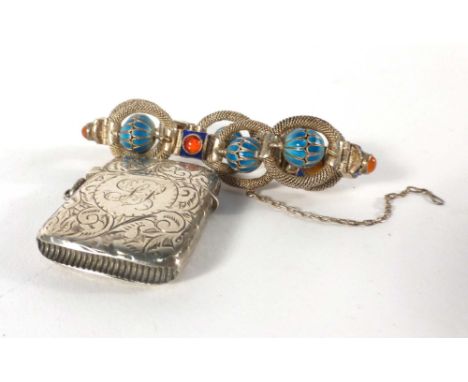 An Eastern metalware bracelet having six circular links decorated in turquoise and blue enamel, together with an Edwardian si