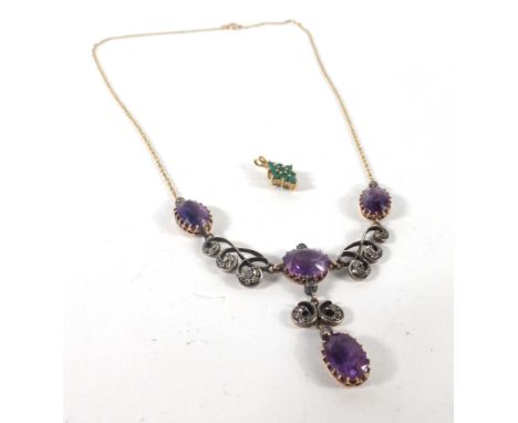 An early 20th century yellow metal chainlink necklace suspending a diamond and amethyst set pendant of Art Nouveau design, to