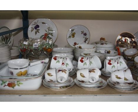 A QUANTITY OF ROYAL WORCESTER EVESHAM PATTERN DINNER, TEA AND SERVING DISHES, together with matching wine glasses (over 90 pi