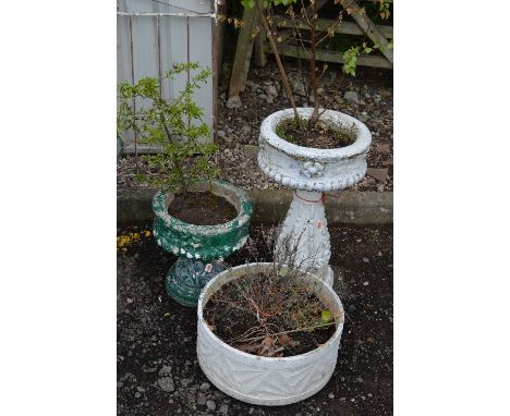 A PAINTED PRE-CAST GARDEN PLANTER, on baluster support, a pre-cast garden urn on seperate base with shrub and a circular plan