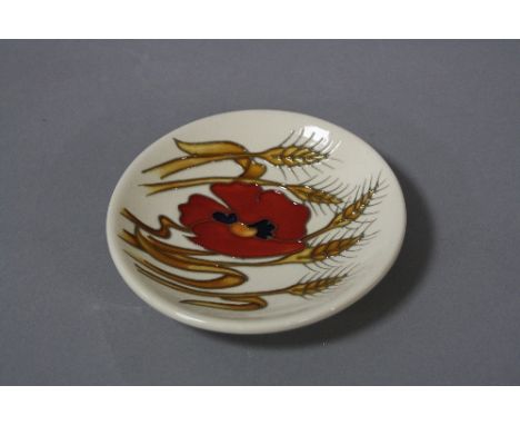 A MOORCROFT POTTERY TRINKET DISH, 'Harvest Poppy' pattern, impressed marks and painted 2009