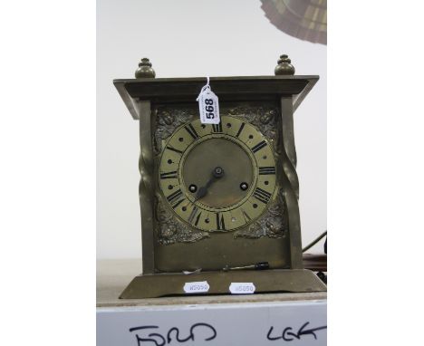 A BRASS CASED MANTEL CLOCK, approximate height 26cm