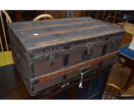 A METAL BOUND TRAVELLING TRUNK