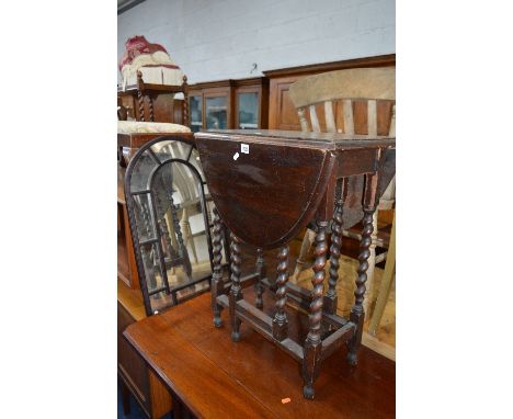 A SMALL OAK BARLEY TWIST GATE LEG TABLE, and a mirror (sd) (2)