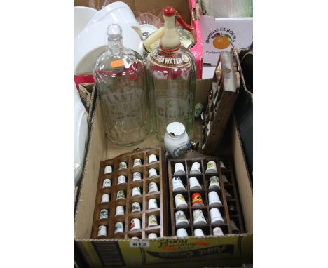 A QUANTITY OF MODERN CERAMIC THIMBLES, glass soda syphon and another soda syphon base