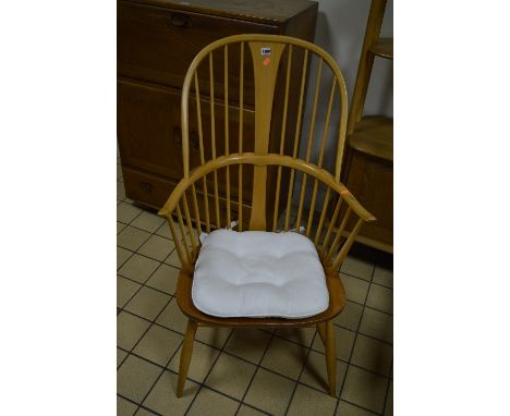 AN ERCOL ELM SPINDLE BACK WINDSOR ARMCHAIR