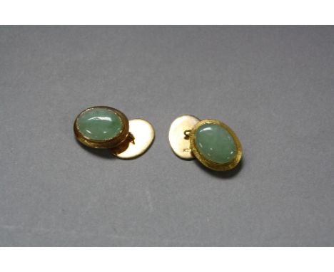 A MODERN PAIR OF JADE CUFFLINKS, oval cabochon cut jadite stones measuring approximately 15.5mm x 12mm, oval disks satin fini