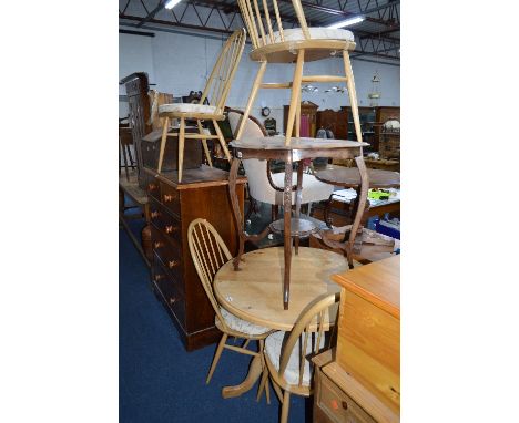 A SET OF FOUR ERCOL ELM SPINDLE BACK DINING CHAIRS, with removable cushions and a circular pine table (5)