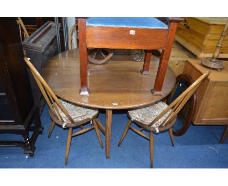 AN ERCOL GATE LEG TABLE, and four spindle back chairs (5)