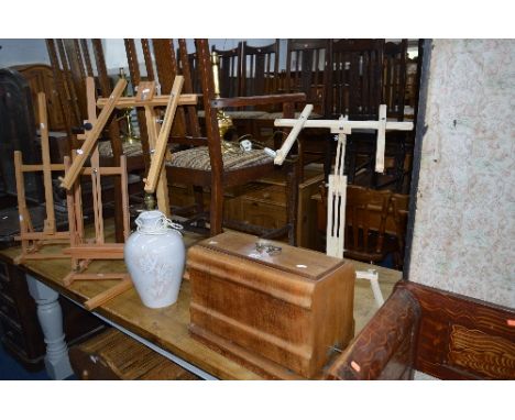 A CASED SEWING MACHINE, two various easels and needlework frames including a Windsor and Newton easel,  and a table lamp (key
