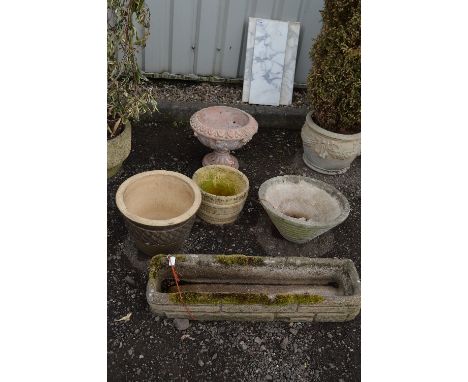 A GARDEN URN, three round plant pots and an oblong planter (5)