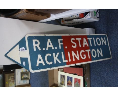 AN ENAMEL SIGN, 'R.A.F. STATION ACKLINGTON', shaped as an arrow pointing left, approximately 25.5cm x 1000cm