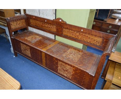 A LONG PINE BRUSH GRAINED BENCH, with lift up lid, approximate size width 196cm x depth 55cm x height 93cm