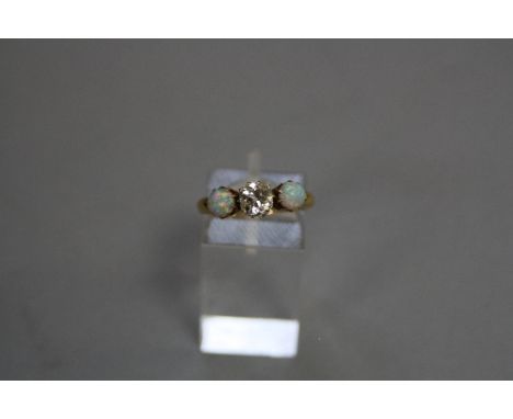 A VICTORIAN 18CT GOLD DIAMOND AND OPAL THREE STONE RING, one cushion old cut diamond estimated weight 0.90ct, colour assessed