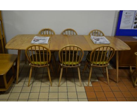 AN ERCOL LIGHT ELM RECTANGULAR EXTENDING DINING TABLE, two extra leaves, approximate extended size width 222cm x depth 91cm x