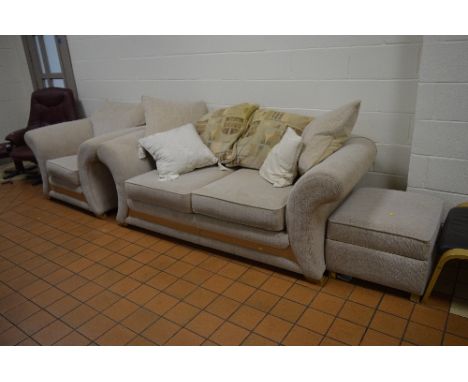 A CREAM UPHOLSTERED THREE PIECE SUITE, comprising of a two seater bed/settee, armchair and a pouffe