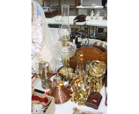 A BRASS OIL LAMP, a projector lamp and various copper and brass