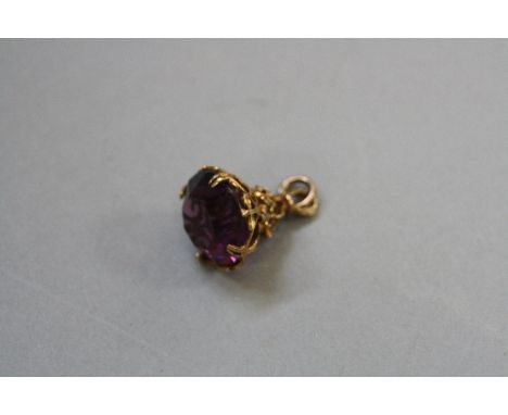 A MID 20TH CENTURY 9CT GOLD AMETHYST FOB, round circular faceted amethyst measuring approximately 18mm in diameter, estimated