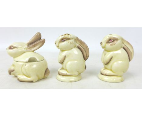 A Clarice Cliff Wilkinson Ltd 'Rabbits' cruet set, tallest 6.5cm high. (3) 