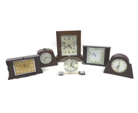 A collection of Art Deco wooden and bakelite mantle clocks, largest 31 by 10.5 by 28cm high, together with a half moon, glass