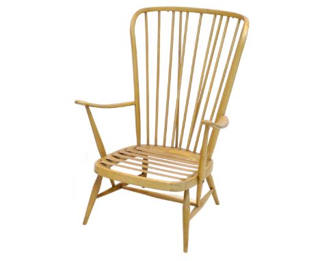 A blonde beech Ercol tall back easy armchair.