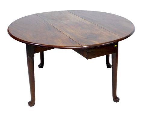 An 19th century mahogany drop leaf dining table, with oval surface, twin gate leg action, raised on turned supports and pad f