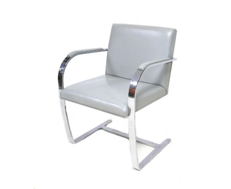 A vintage Knoll BRNO open armchair, designed by Ludwig Mies van Der Rohe and Lilly Reich, chromed steel and grey leather seat