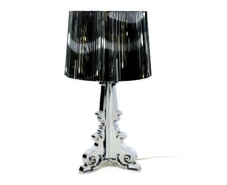 A Kartell Bourgie perspex table lamp, silvered finish, designed by Ferruccio Laviani, 32 by 69cm high. 