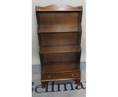 A modern stained beech waterfall bookcase, the single drawer base on bracket feet, 56cm wide x 114cm high.